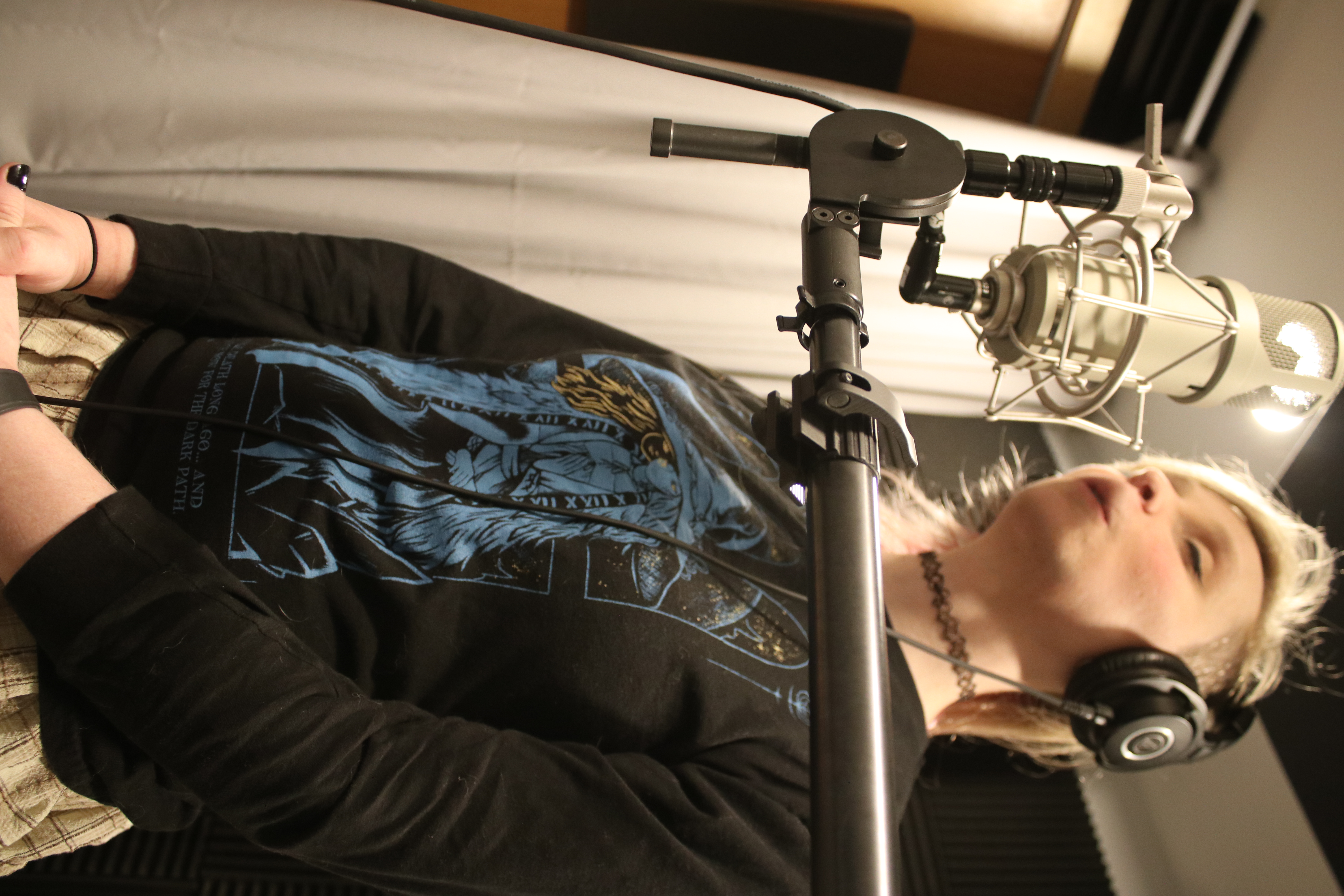 Hailey in the vocal booth recording harmonies