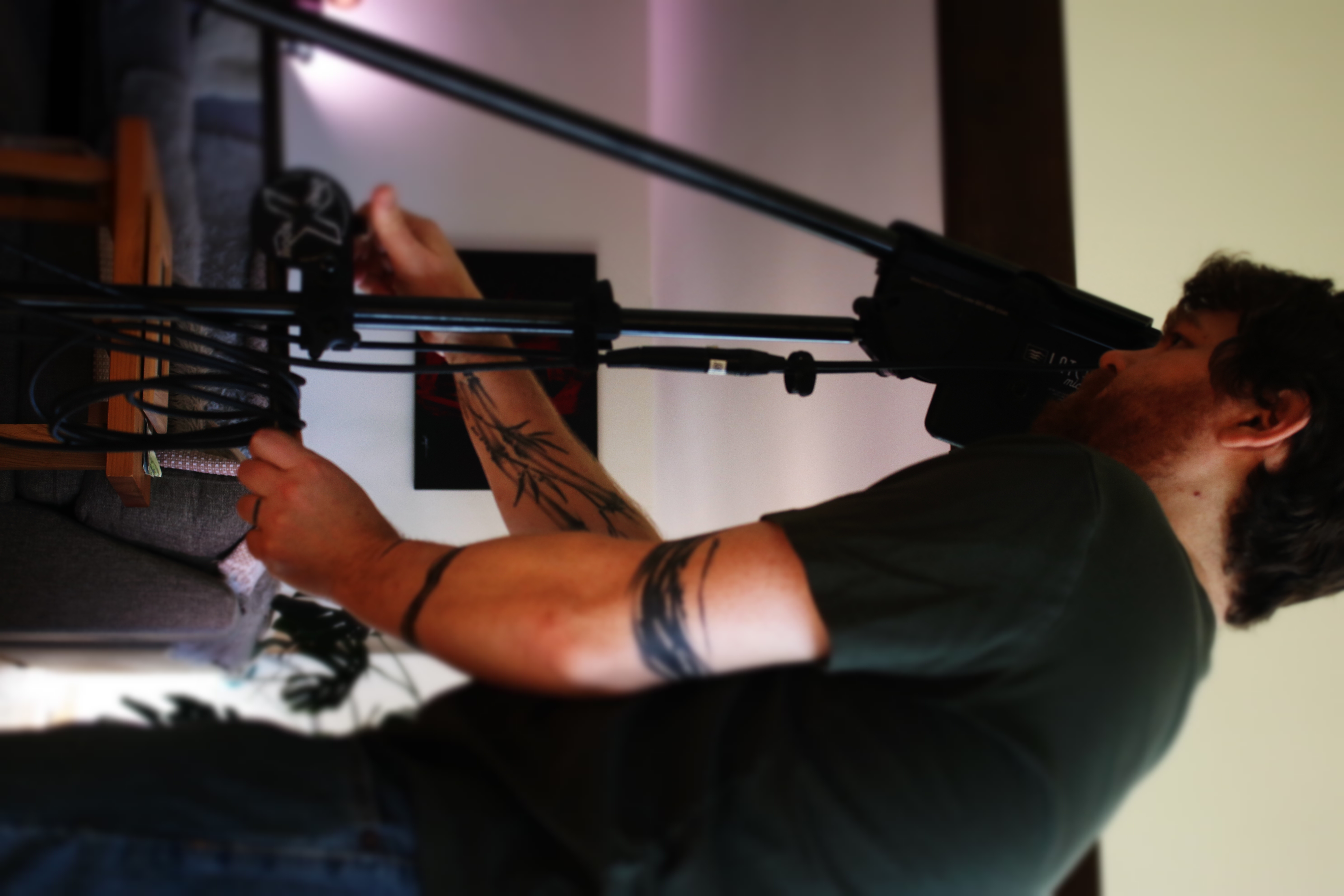Nathan Douds of Incite Studio adjusting a mic stand